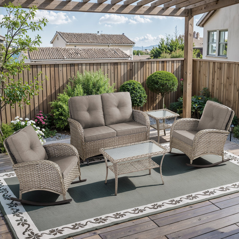 This Handcrafted 5-Piece Outdoor Seating Group Infuse Your Porch Or Patio With Timeless Charm And Natural Elegance. The Set Includes A Glider Loveseat,  2 Classic Rocking Armchairs, A Side Table And A Coffee Table, Hand Woven PE Wicker Paired With A Curv