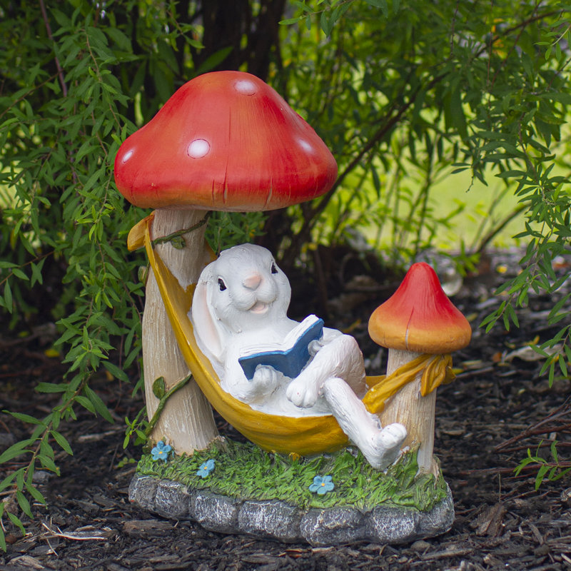 White Bunny in Yellow Hammock with Red Mushrooms Garden Statue