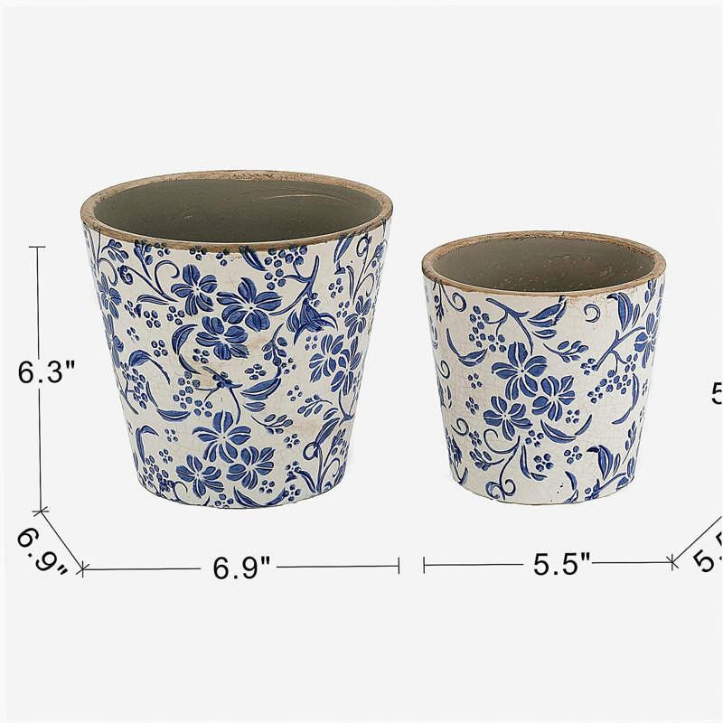 S / 2 jardinières en céramique bleue et blanche à motif floral