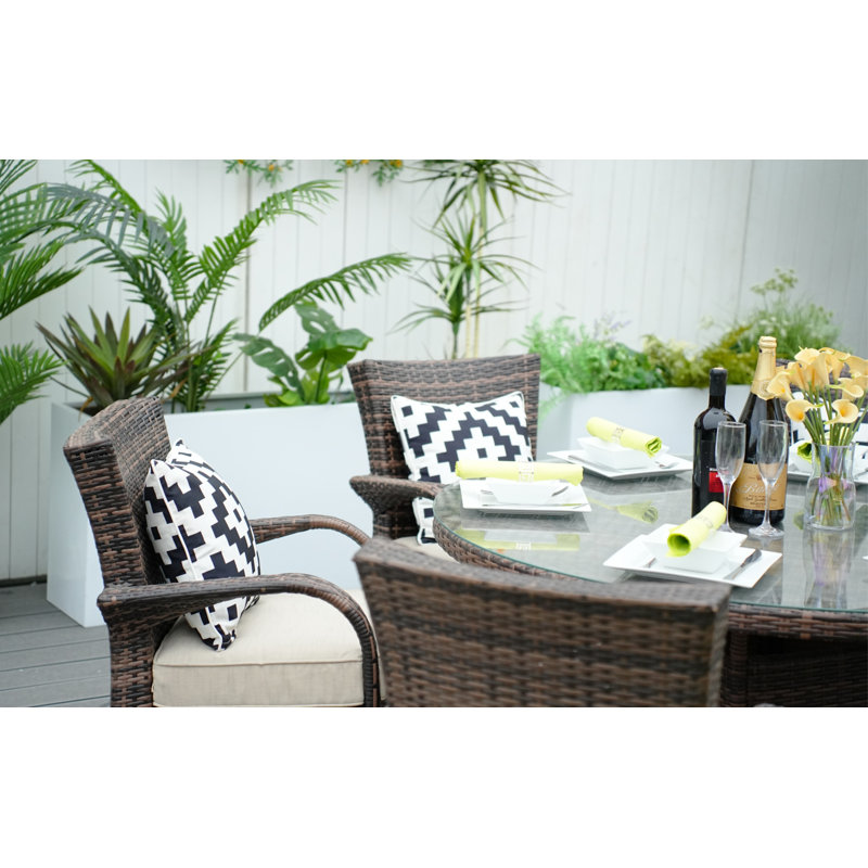 Indiya 6 - Person Premium All-Weather Wicker Patio Dining Set with Round Table , Cushions Included