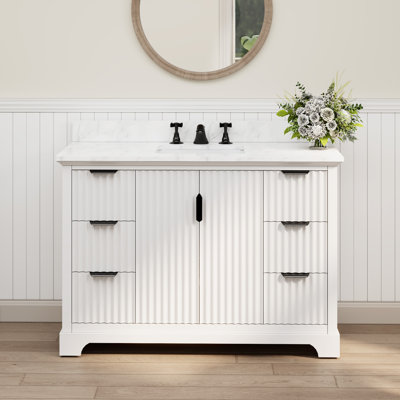 Meuble-lavabo simple Barnhart 48 po entièrement assemblé avec comptoir en pierre reconstituée, lavabo en céramique, peinture à la main, tiroirs à fermeture amortie sous le meuble et charnières de porte à fermeture amortie, dosseret inclus