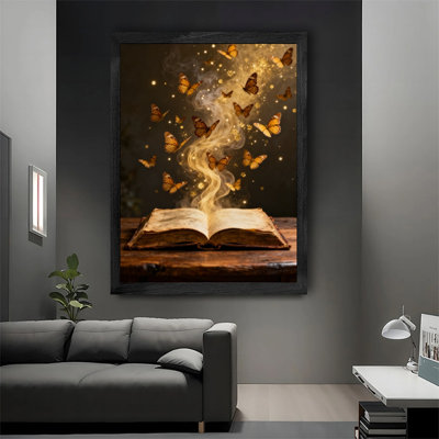 Reproduction d'art encadré noir avec papillon doré et livre mystique
