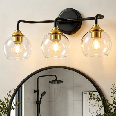 Applique murale 3 lumières pour salle de bain, applique murale noire et dorée avec abat-jour en verre transparent, éclairage de meuble-lavabo mural de style campagne moderne pour miroir de salle de bain, coiffeuse