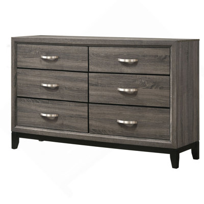 La commode à 6 tiroirs de large avec une finition en bois texturé offre un rangement spacieux et moderne pour les chambres à coucher