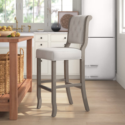 Radele Upholstered Counter Stool with Solid Wood Frame