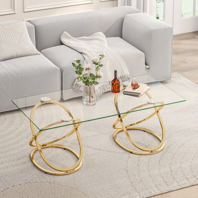 Table basse 31,50 "en verre rectangulaire moderne avec cadres en forme d'anneau, structure en métal et verre trempé transparent, table de centre de luxe pour le salon, la chambre à coucher et le bureau, or