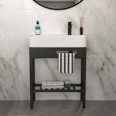 Lavabo console en céramique d'inspiration rétro avec planche à laver intégrée et pieds noirs élégants, idéal pour les petites salles de bain et l'entretien facile