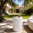 Modern White Outdoor Side Table with Wavy Fluted Design - 15.75" Round, 21.97" H, MGO Material, 66 lbs Capacity, Assembly-Free for Patio, Garden, or Balcony