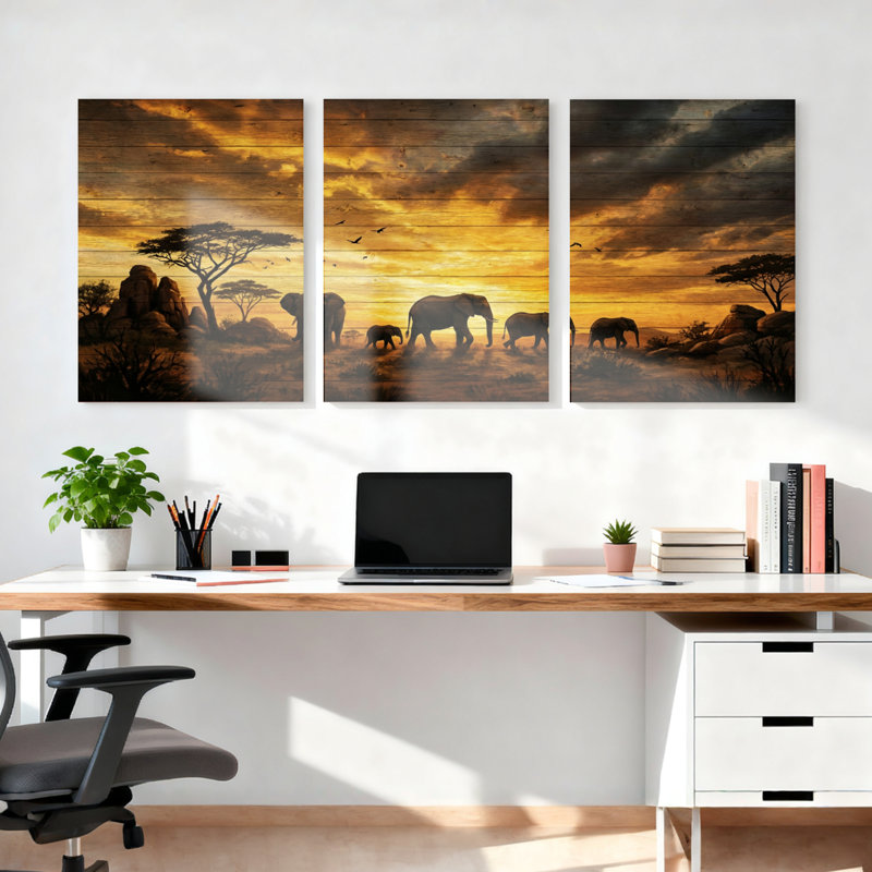 Ensemble de 3 tableaux sur toile représentant un troupeau d'éléphants au coucher du soleil, représentant un safari africain.