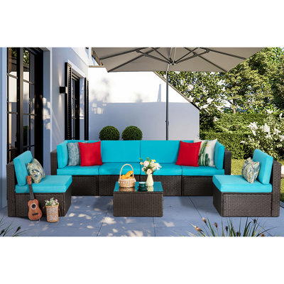  Ensemble de patio modulaire d'extérieur en osier 7 pièces avec coussins, coussins et table basse en verre Arleht