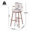 Tabouret de bar industriel moderne avec structure en métal et accoudoirs courbés