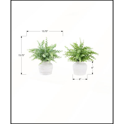Ensemble de 2 brins d'eucalyptus artificiels, 40 cm de hauteur, dans des pots blancs modernes pour une décoration de table contemporaine.