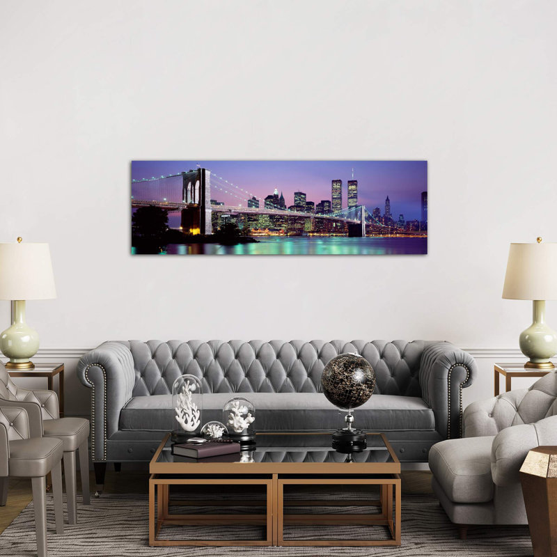 An Illuminated Brooklyn Bridge With Lower Manhattan's Financial District Skyline In The Background, New York City, New York - No Frame Panoramic Print on Canvas
