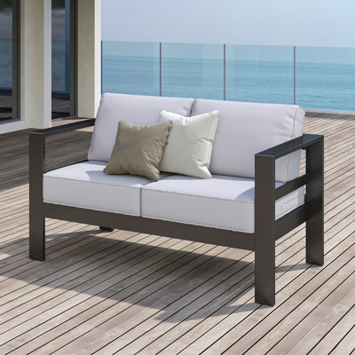 Arnhildur Braidan 53" Wide Aluminum Outdoor Loveseat with Cushions by Wade Logan