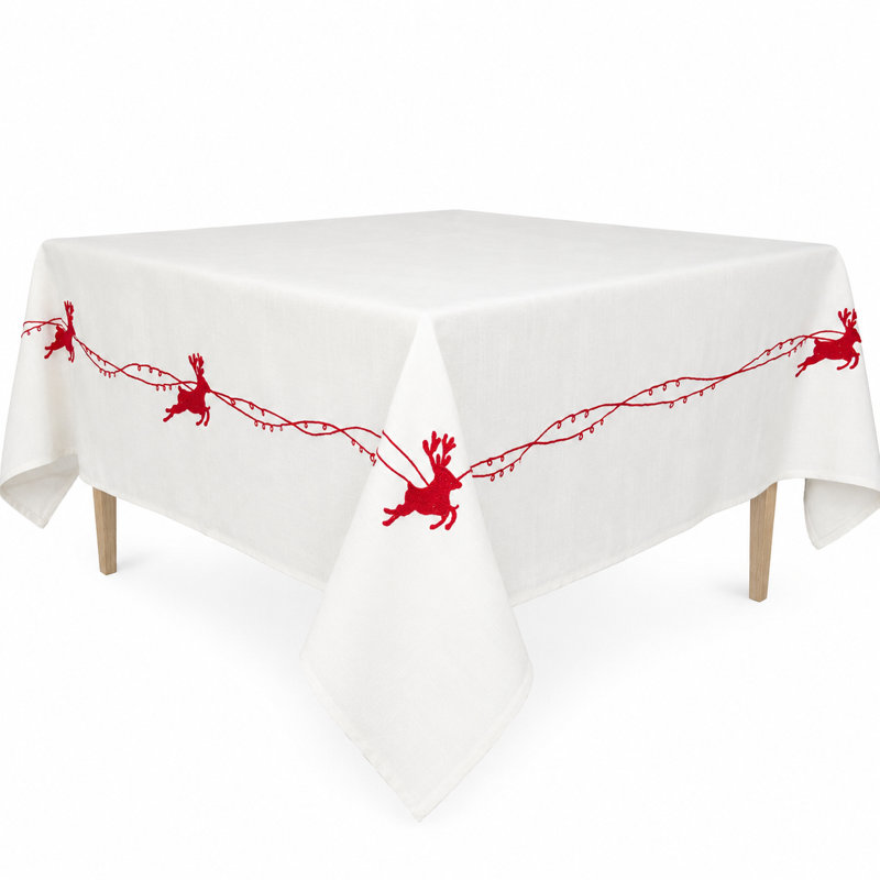 Nappe de fÃªte brodÃ©e au point de croix reprÃ©sentant le traÃ®neau du PÃ¨re NoÃ«l avec ses clochettes et ses rennes