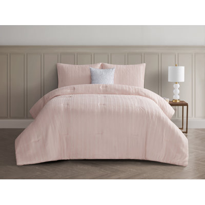 Anais 4 Piece Reversible Crinkle Comforter Set and throw pillow