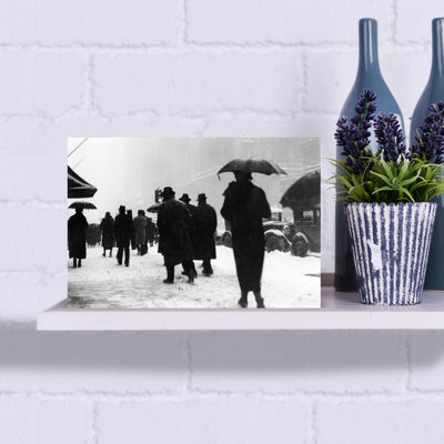 1920S 1930S Crowd Of Anonymous Pedestrians Silhouetted By Snow Storm Walking On City Street Sidewalk Classic Retro Vintage City Wall Art