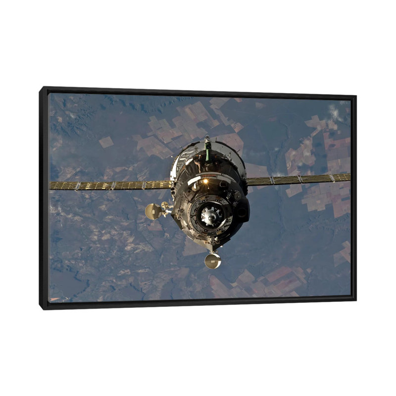 " The Soyuz TMA-19 Spacecraft " by Stocktrek Images, 18" H x 26" W x 1.5" D, Black Framed Canvas, No Mat
