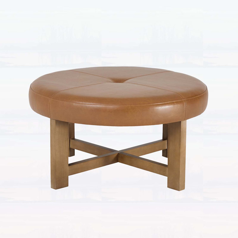 Table basse ronde avec repose-pieds en cuir et base en bois, repose-pieds capitonné en similicuir, plateau brun avec pieds en noyer