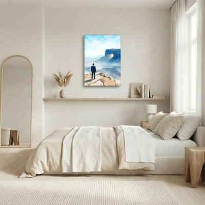 Man in Blue Suit Viewing Glowing Portal on Rocky Mesa Canvas Wall Art