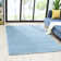 Solid Color Machine Woven Polypropylene Area Rug in Blue