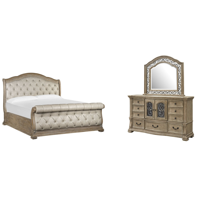 Grand lit-bateau tapissier et commode avec miroir