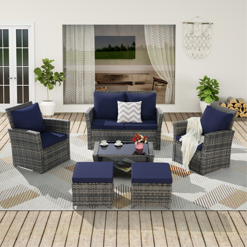 Ensemble de meubles de patio en osier 6 pièces avec repose-pieds et table basse en verre trempé, Bleu très foncé