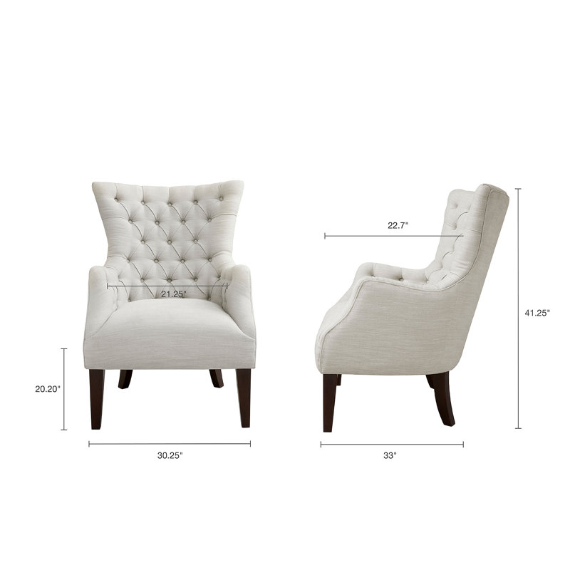 Fauteuil à oreilles capitonné