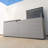 Suncast 59 in. W x 24 in. D Resin Deck Box with Split Lid and Shock-Assisted Opening, Made in the USA