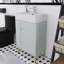Meuble-lavabo autoportant de 22 po avec lavabo simple en céramique et porte à fermeture en douceur, rangement à gauche-283884204