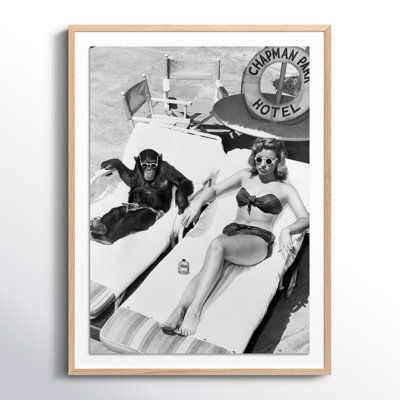 Woman Sunbathing With Chimpanzee by Getty Images