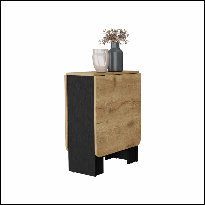 Table de salle à manger Cole Black et Macadamia pliante, conception compacte avec esthétique moderne et élégante pour les espaces de vie compacts.