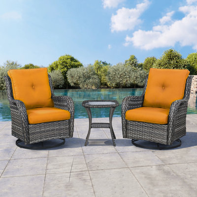 Chaise berçante en osier avec coussins Schutt