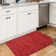 Ellicia Solid Color Polyester Area Rug in Red/Orange
