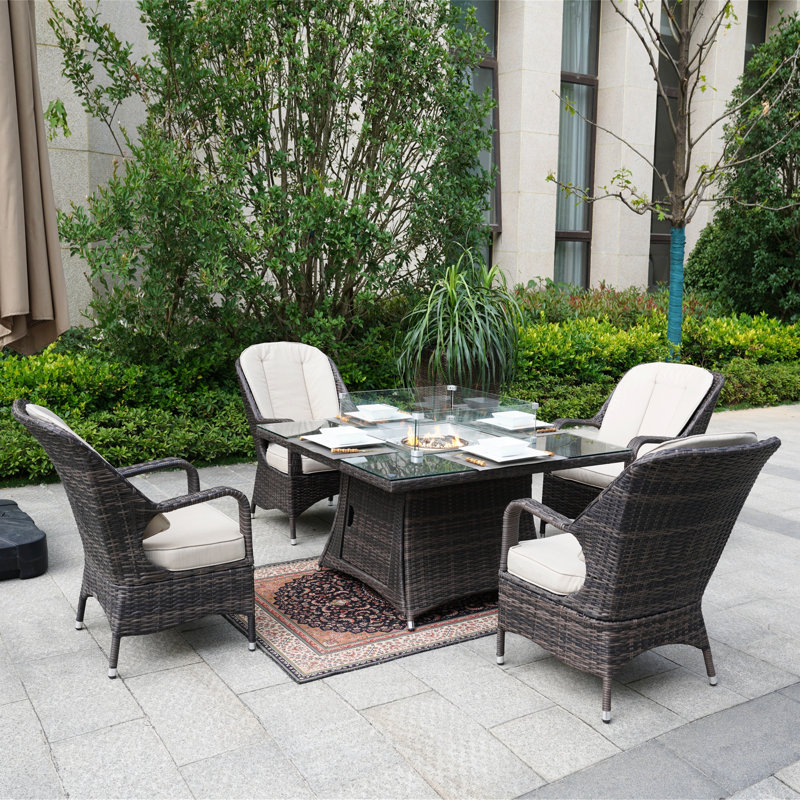 Aliaga 4 - Person Wicker Patio Dining Set with Square Table , Cushions Included