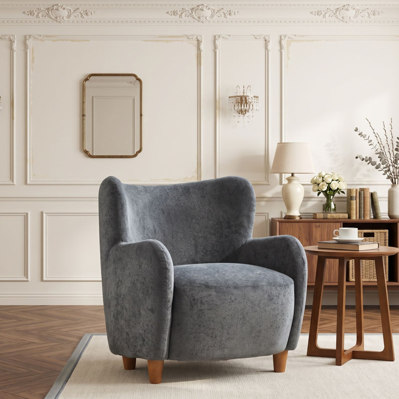 Fauteuil à oreilles avec pieds en bois massif et coussin à ressorts ensachés pour salon ou chambre