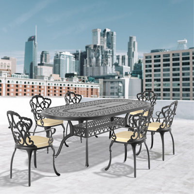 7-Piece Set Of Cast Aluminum Patio Furniture With Black Frame And Off-White Seat Cushions