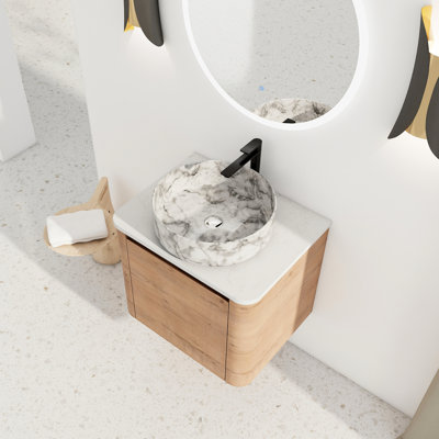 Meuble-lavabo suspendu de 61 cm (24 po) avec lavabo en céramique décorative, porte simple à fermeture douce, livré démonté, construction en contreplaqué, bords arrondis pour une esthétique soignée, finition lisse de la vasque, charnières silencieuses.