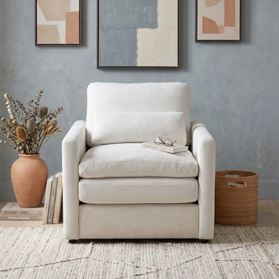 Fauteuil rembourré avec coussin double couche, accoudoirs roulés, coussin lombaire, assise profonde et dossier amovible