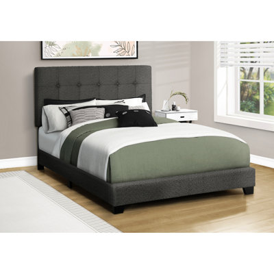 Cadre de lit rembourré deux places en tissu bouclé gris foncé avec pieds noirs massifs, sommier à lattes en bois d'ingénierie, design bas, tête de lit capitonnée et rembourrage épais, idéal pour une chambre de style transitionnel.