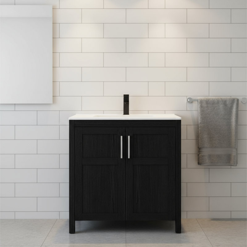 Ce meuble-lavabo autoportant noir comprend un lavabo et un lavabo en céramique avec deux portes à fermeture en douceur. C'est à la fois simple, sophistiqué, pratique et élégant.