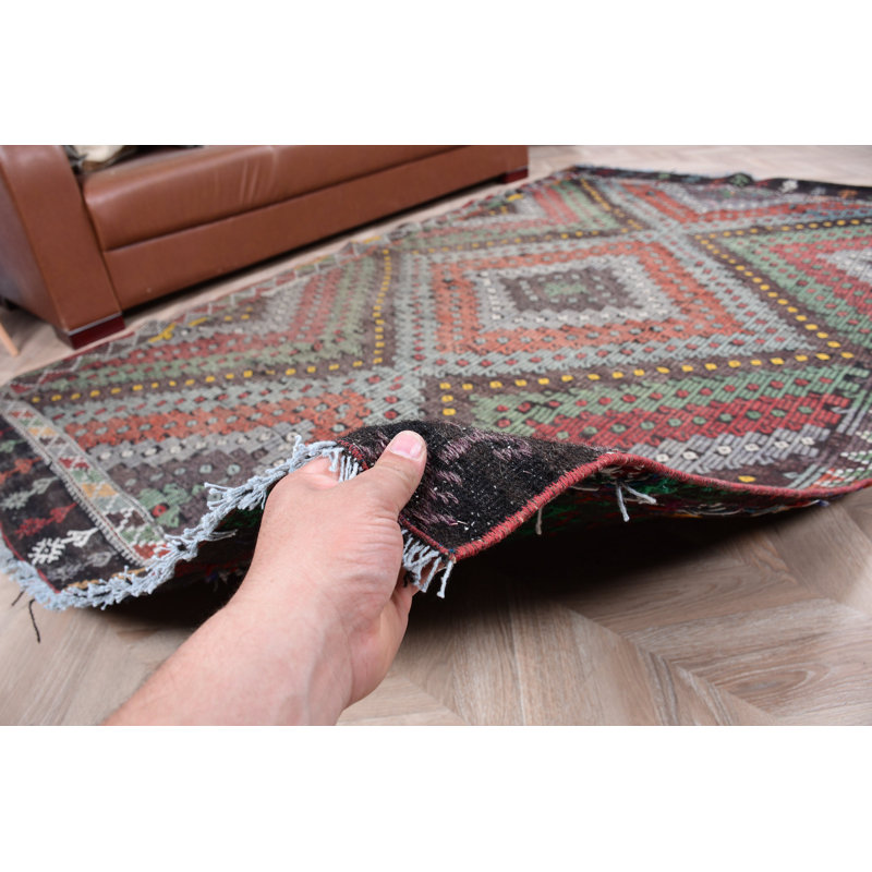 Tapis turc fabriqué à la main dans des tons de terre, idéal pour décorer un salon ou une chambre à coucher