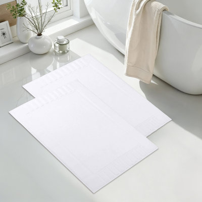 Tapis de bain 100% coton à bordure géométrique 