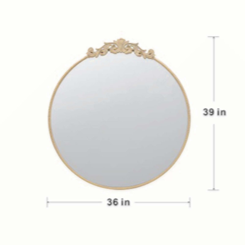 Miroir de conception classique avec forme ronde et cadre d'inspiration baroque pour la salle de bain, console de vestibule posée contre le mur