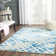 Bryauna Hand Tufted Wool/Cotton Geometric Rug in Blue/Ivory