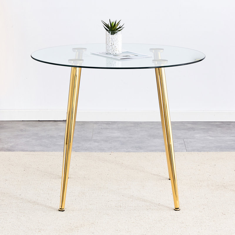Élégante table ronde avec surface en verre transparent et pieds dorés, plateau chic en verre moderne Home Chic Touch Redéfinissez votre style