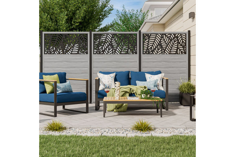 brick patio with a outdoor furniture surrounded by a wood privacy fence