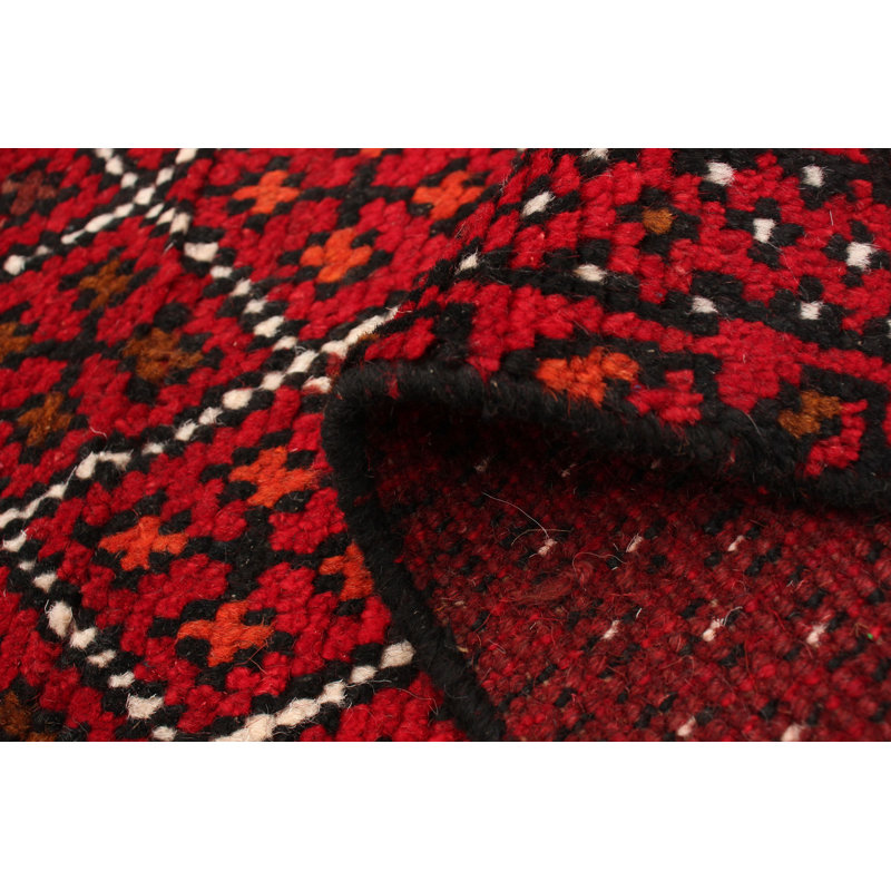 Tapis rouge en laine noué à la main