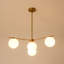 Lustre spoutnik contemporain en laiton 4 lumières avec abat-jour en verre opale (30,7 po)