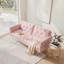 Canapé-lit convertible en velours rose ultra-doux avec garniture cloutée et coussin décoratif assorti, parfait pour les espaces de vie compacts